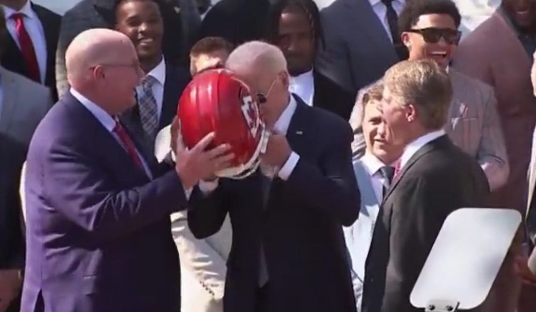 WATCH: Kansas City Chiefs Laugh at Biden as He Struggles with Helmet