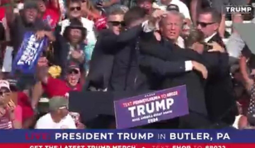 BREAKING: 8 Shots Fired at Trump Rally – Ambulance Rushes Trump Away After Assassination Attempt – Blood Runs Down His Face (VIDEO)