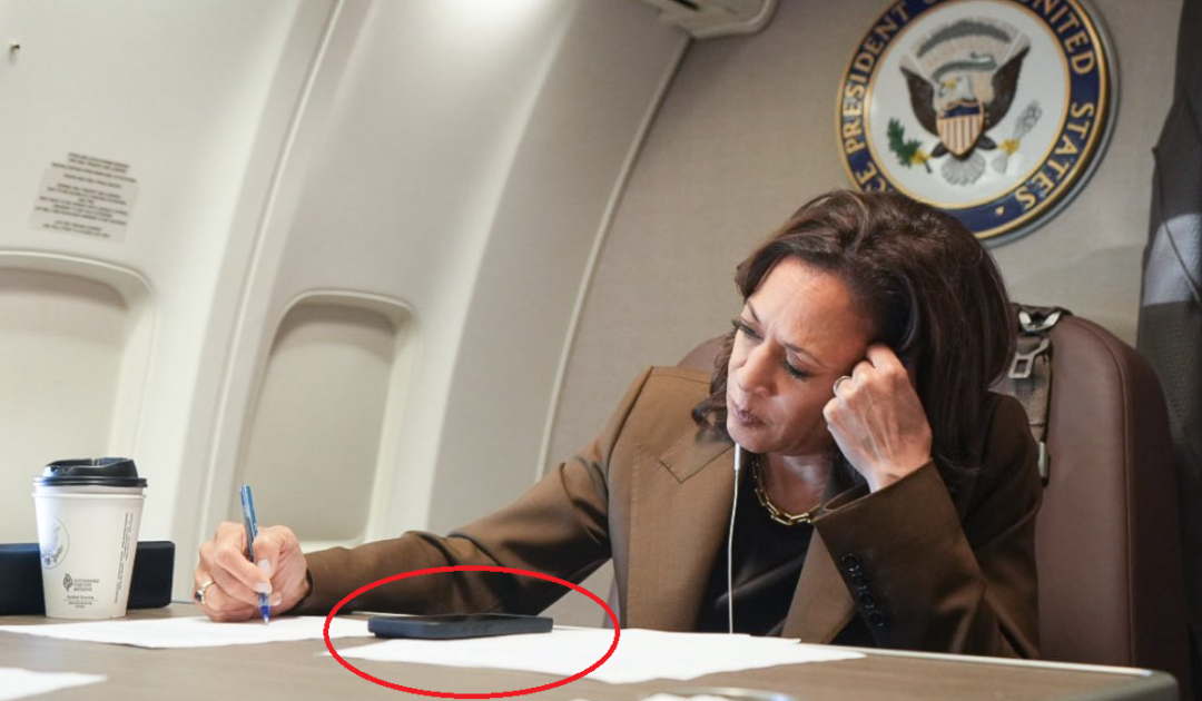 ANOTHER PHOTO-OP FAKE: Kamala Harris Pretends to Be Briefed on Hurricane Helene Damages But Her Earphones Are Not Attached to the Phone