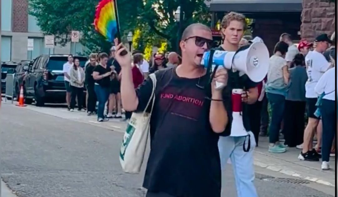 SICK: Godless Pro-Abortion Protester Chants “Erika Kirk Has Got To Go” at TPUSA’s First Campus Event Since Charlie Kirk’s Assassination