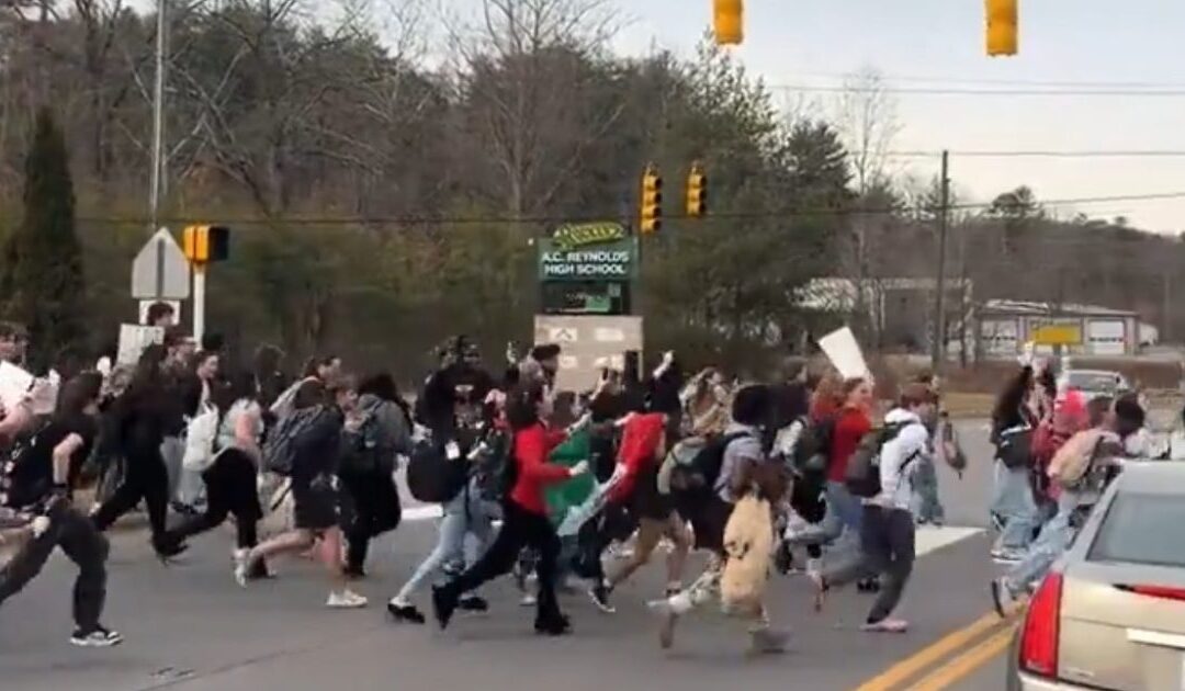 WATCH: Horrifying Footage Shows North Carolina High School Students Bolt Out of Class and Run Across Busy 4-Lane Highway to Protest ICE – No Teachers in Sight