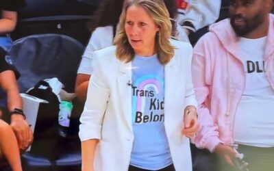 SICK: Crazy Minnesota Lynx Coach Wears “Trans Kids Belong” T-Shirt to Fever Game with Sophie Cunningham