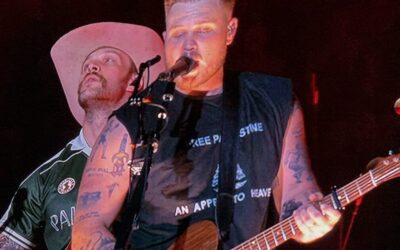 Zach Bryan ‘Bud Lights’ Himself — U.S.  Navy Vet and Band Members Wear T-shirts With Unpopular Woke Messages On Stage [VIDEO]